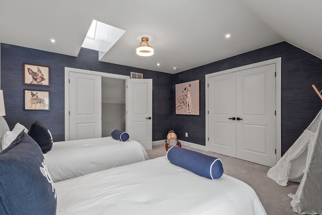 bedroom featuring carpet floors, a closet, and wallpapered walls