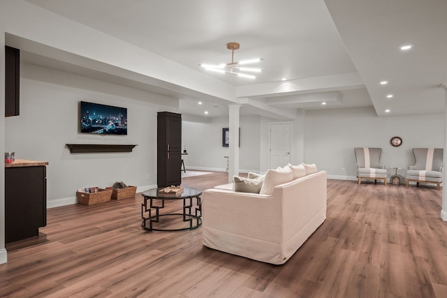 living area featuring recessed lighting, wood finished floors, and baseboards