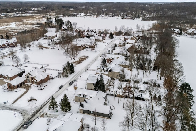 snowy aerial view featuring a residential view