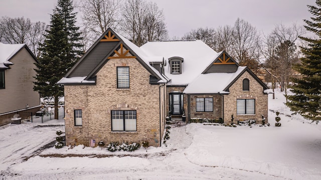 view of front of home featuring brick siding