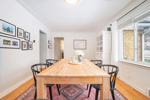 dining area with light wood-type flooring