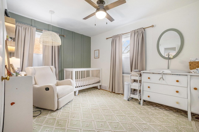 bedroom featuring a nursery area