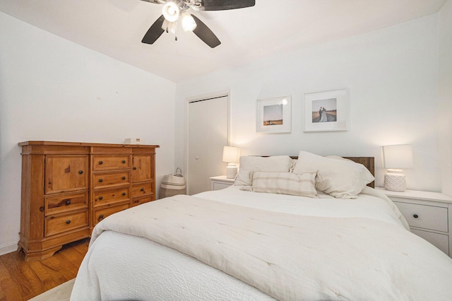 bedroom with hardwood / wood-style flooring and ceiling fan