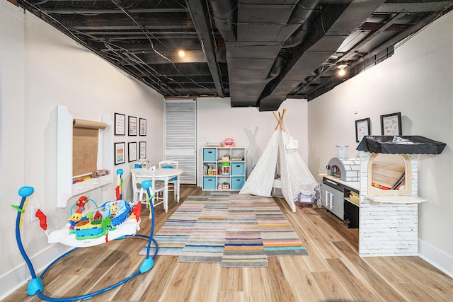 playroom featuring wood-type flooring