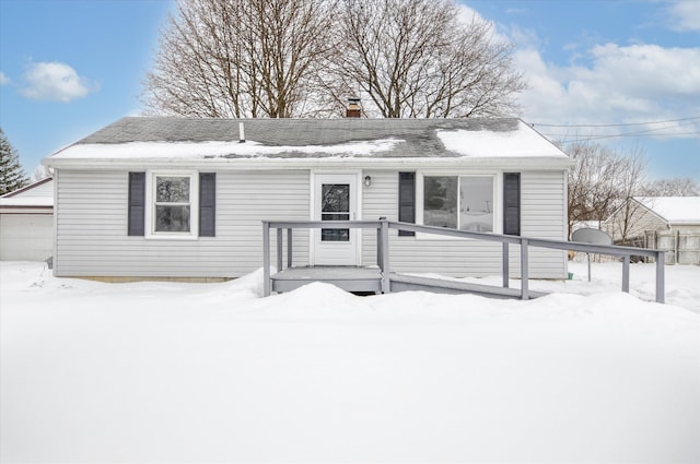 ranch-style home with a detached garage