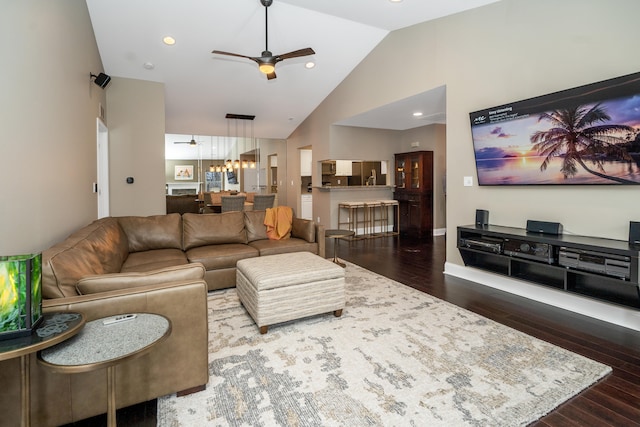 living area featuring ceiling fan, high vaulted ceiling, dark wood-style flooring, and recessed lighting