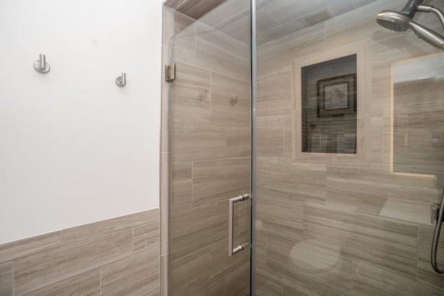 full bath featuring a shower stall