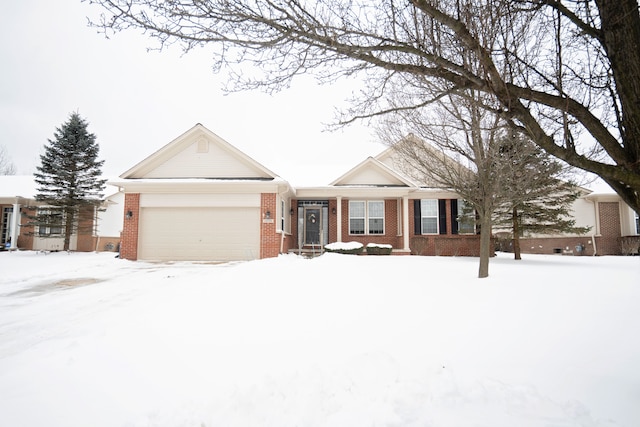 single story home with a garage and brick siding