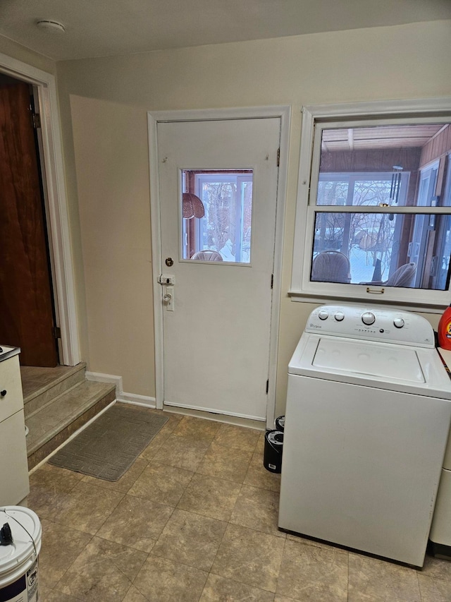 laundry room with washer / dryer, baseboards, and laundry area