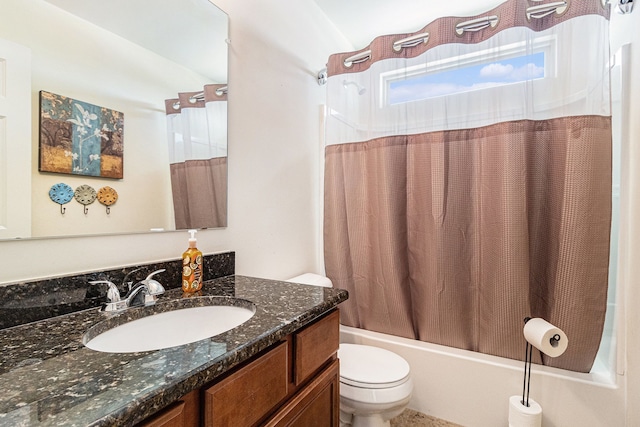 bathroom featuring toilet, shower / tub combo, and vanity