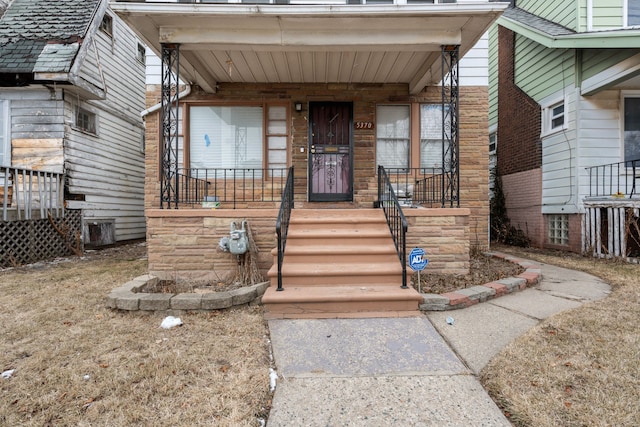 property entrance featuring covered porch