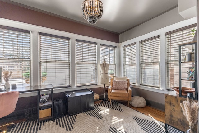 sunroom with a notable chandelier