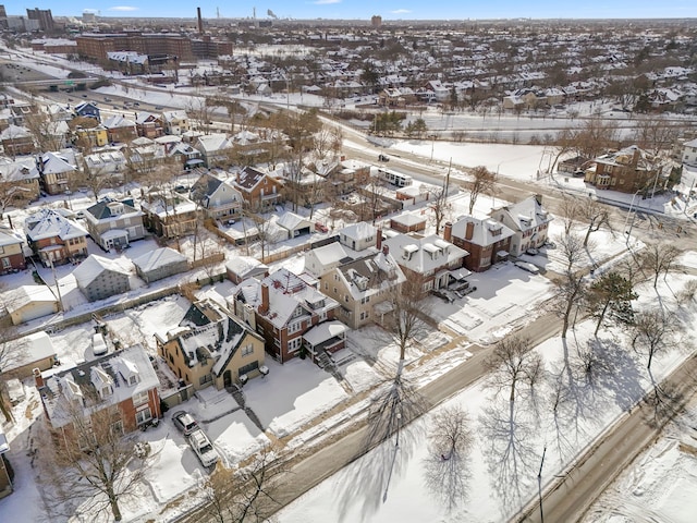 snowy aerial view featuring a residential view