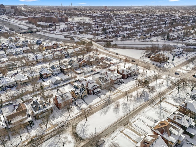 snowy aerial view featuring a residential view