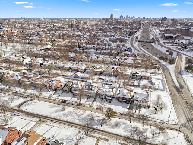 snowy aerial view featuring a view of city