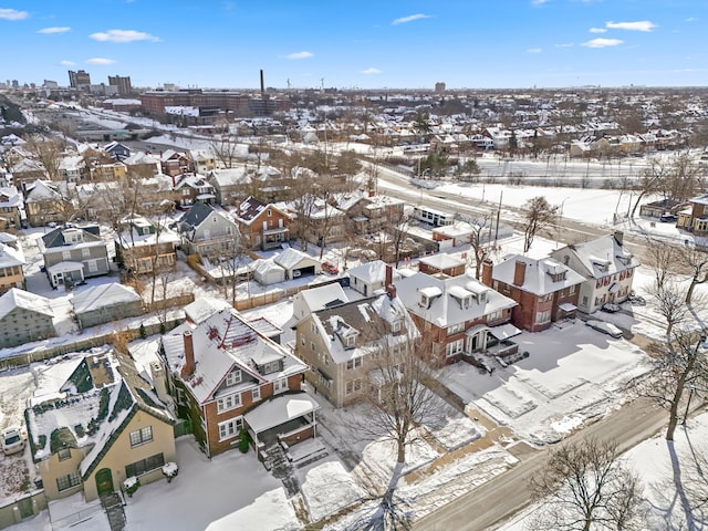 snowy aerial view with a residential view