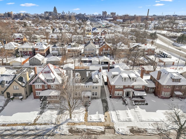 snowy aerial view with a residential view