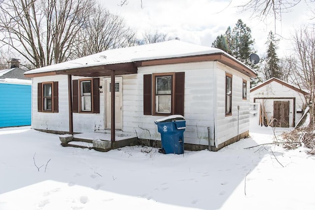 view of front of house featuring a storage shed