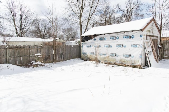 view of yard layered in snow