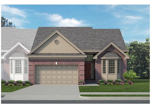 view of front facade with a front yard and a garage