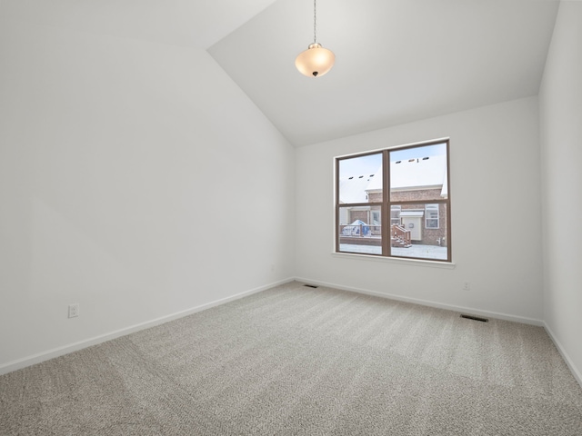 unfurnished room with carpet and lofted ceiling