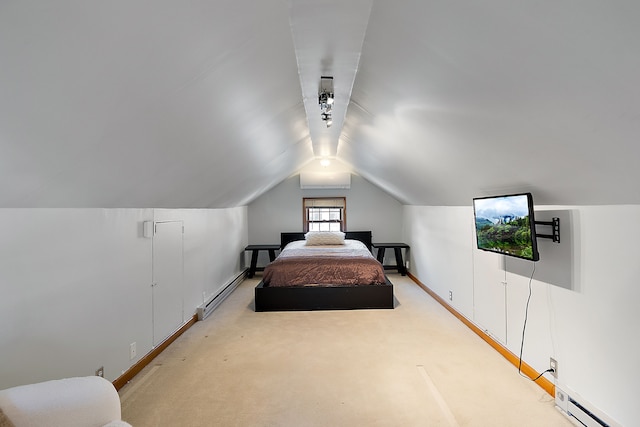 bedroom featuring a baseboard heating unit, vaulted ceiling, and light colored carpet