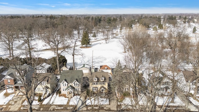 snowy aerial view featuring a residential view