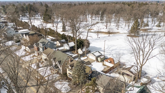 snowy aerial view with a residential view