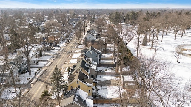 snowy aerial view featuring a residential view