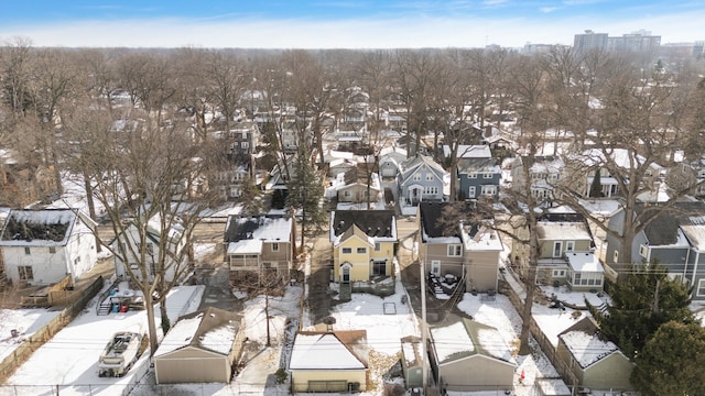 snowy aerial view featuring a residential view