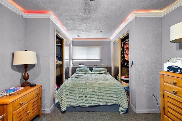 bedroom featuring crown molding, a textured ceiling, and a textured wall