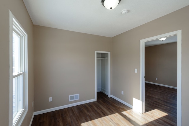 empty room featuring dark hardwood / wood-style floors