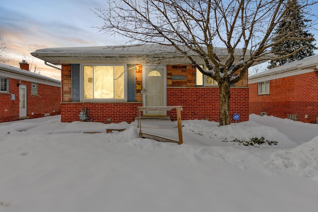 bungalow with brick siding