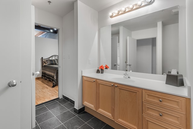 bathroom with tile patterned flooring and vanity