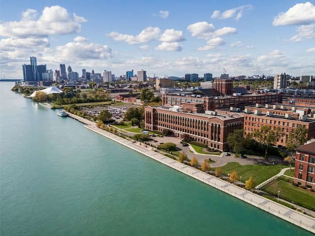 drone / aerial view with a view of city and a water view