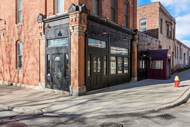 exterior space with brick siding