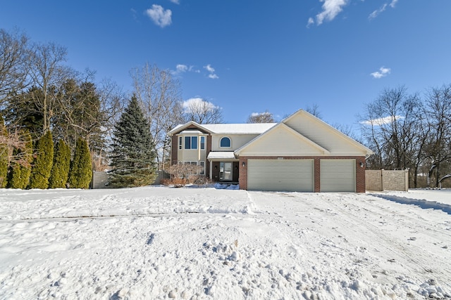 view of front of property featuring brick siding and an attached garage