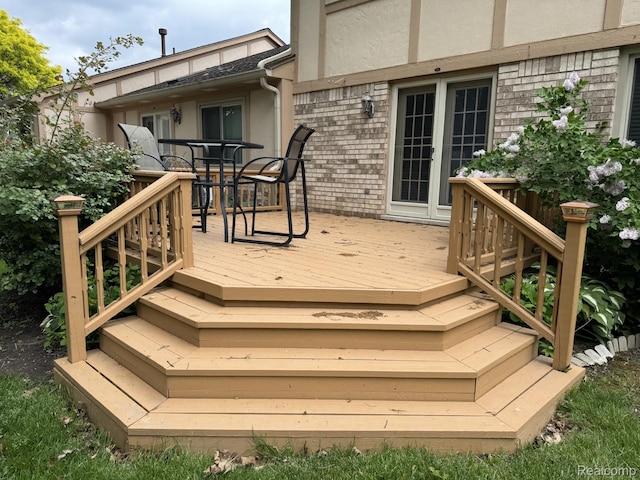 42201 Hidden Brook Dr Unit 68, Clinton Township, MI 48038 - wooden deck featuring outdoor dining area and stairway