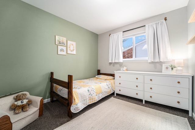 carpeted bedroom featuring baseboards