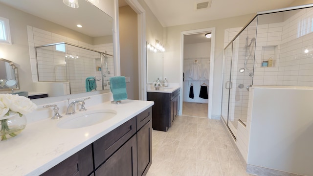 bathroom with vanity and walk in shower