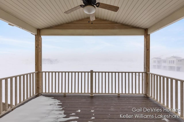 wooden deck featuring a ceiling fan