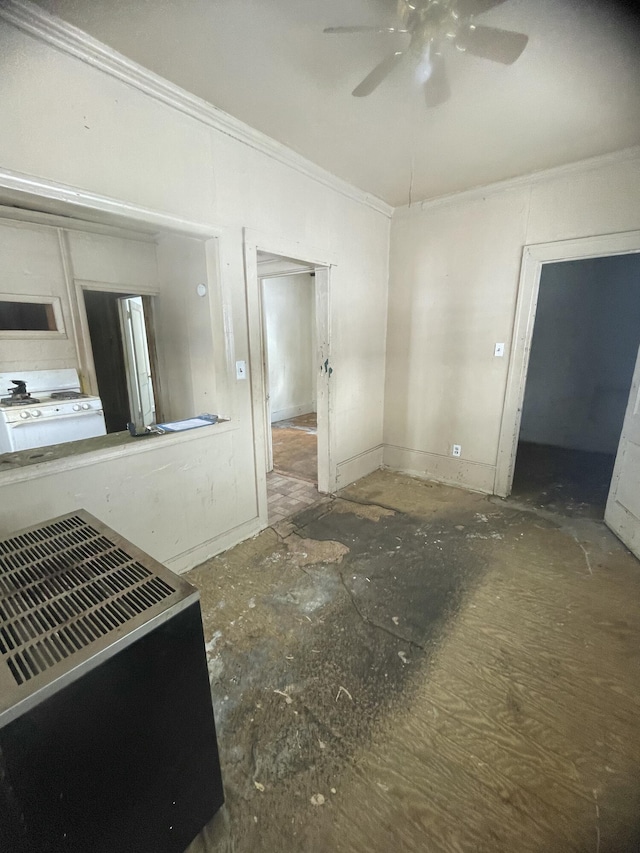 interior space with crown molding and ceiling fan