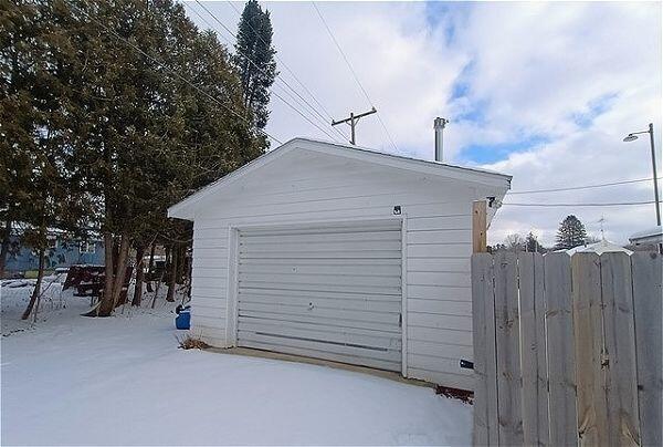 view of snow covered garage