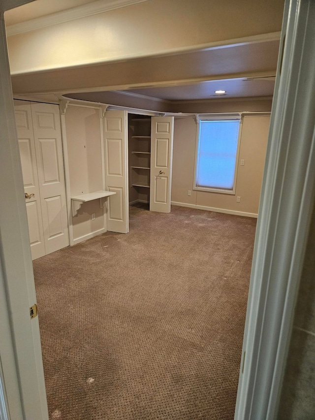 unfurnished bedroom with a closet and carpet flooring