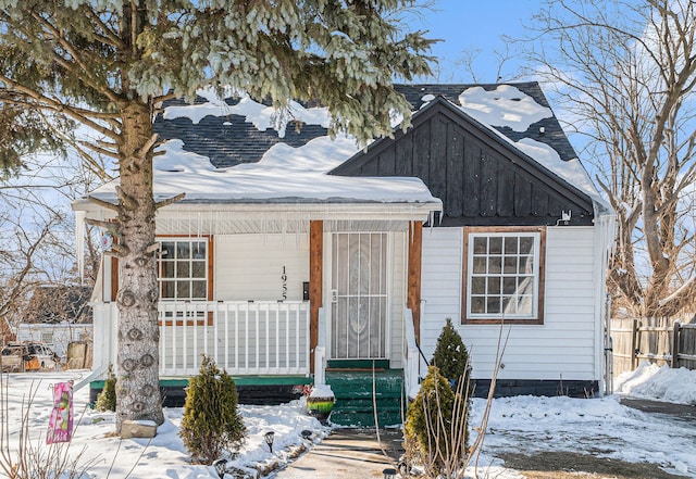 view of front facade featuring covered porch and board and batten siding