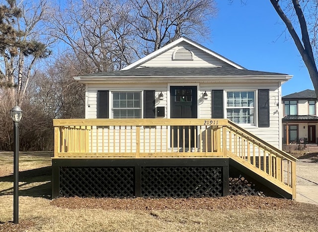 bungalow-style home with a deck