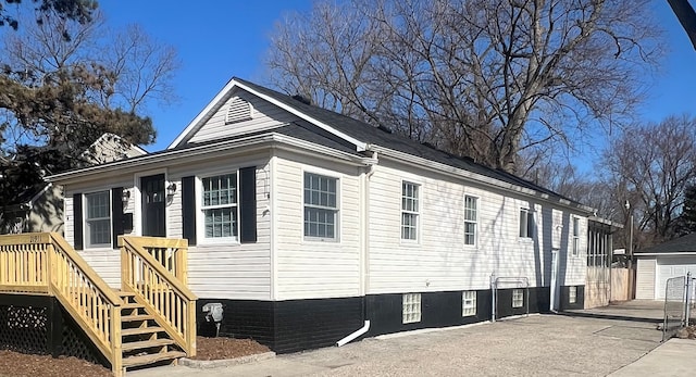 view of side of home with an outbuilding