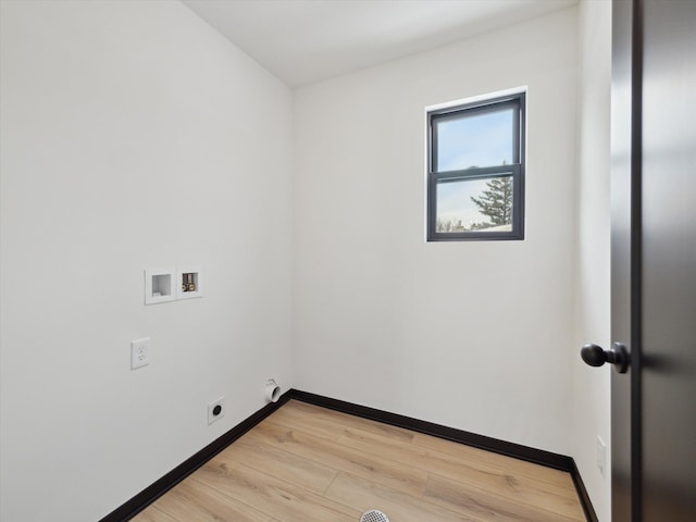 laundry area with hookup for a washing machine, light wood-style floors, electric dryer hookup, laundry area, and baseboards