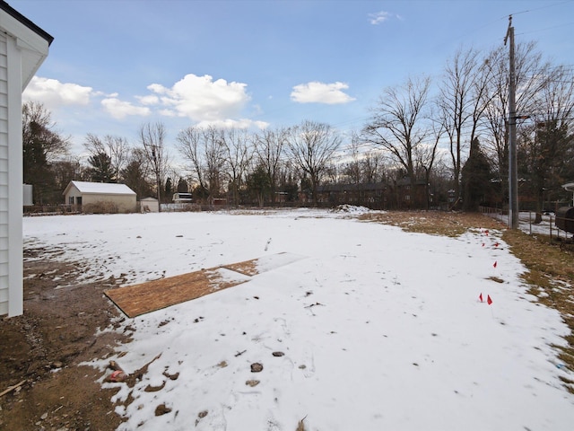 view of yard layered in snow