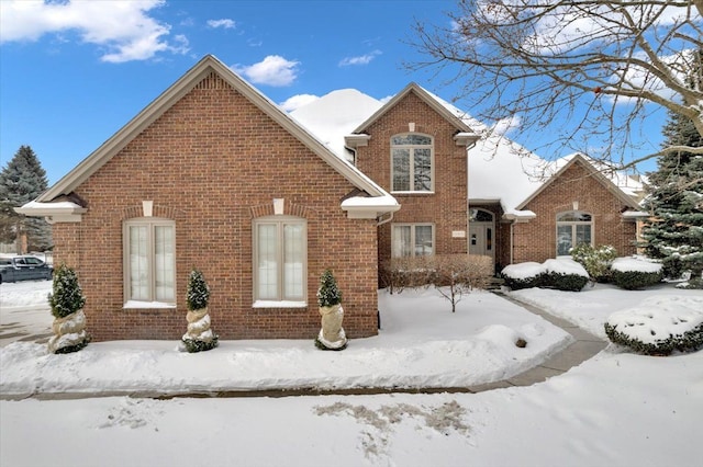 traditional-style home with brick siding